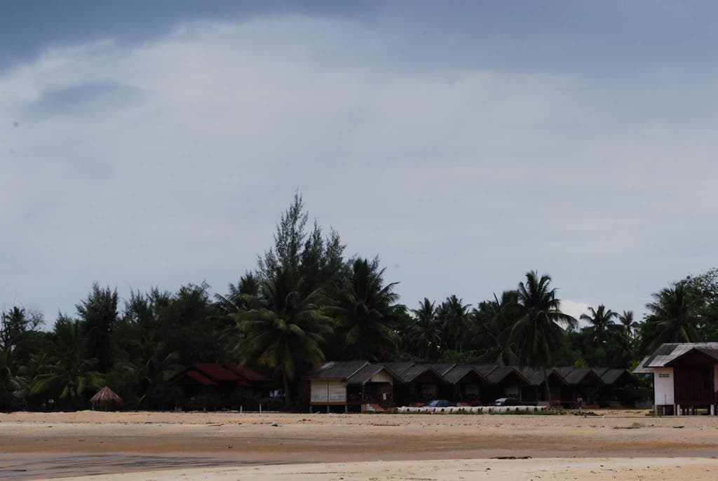 Traditional wooden chalets behind Cherating beach