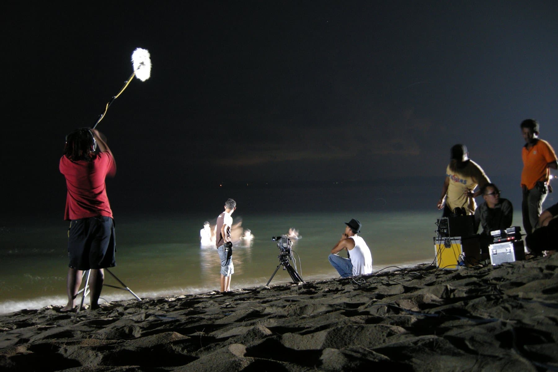 People on the sand at Cherating beach on the South China Sea